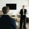 Confident certified life coach in modern office working with clients, representing 2025 life coach certification journey
