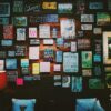 Vision board on a wall featuring images and words related to success, motivation, and personal growth—used by coaches for visualization and goal-setting.