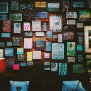 Vision board on a wall featuring images and words related to success, motivation, and personal growth—used by coaches for visualization and goal-setting.