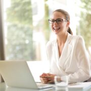 A confident person standing at a crossroads or starting line, symbolizing a fresh start and career transition into life coaching.
