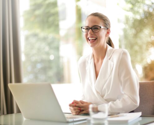 A confident person standing at a crossroads or starting line, symbolizing a fresh start and career transition into life coaching.