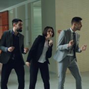 Corporate employees participating in a fun team activity promoting workplace wellness and engagement