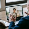 Online coaching discovery call with client and coach discussing goals over video meeting
