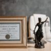 Framed life coach certification displayed in a professional office, representing coaching credentials and career development