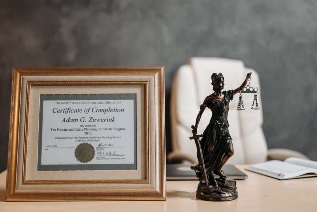 Framed life coach certification displayed in a professional office, representing coaching credentials and career development