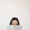 Coaching for introverts concept with a thoughtful person reading quietly, representing self-reflection and personal growth