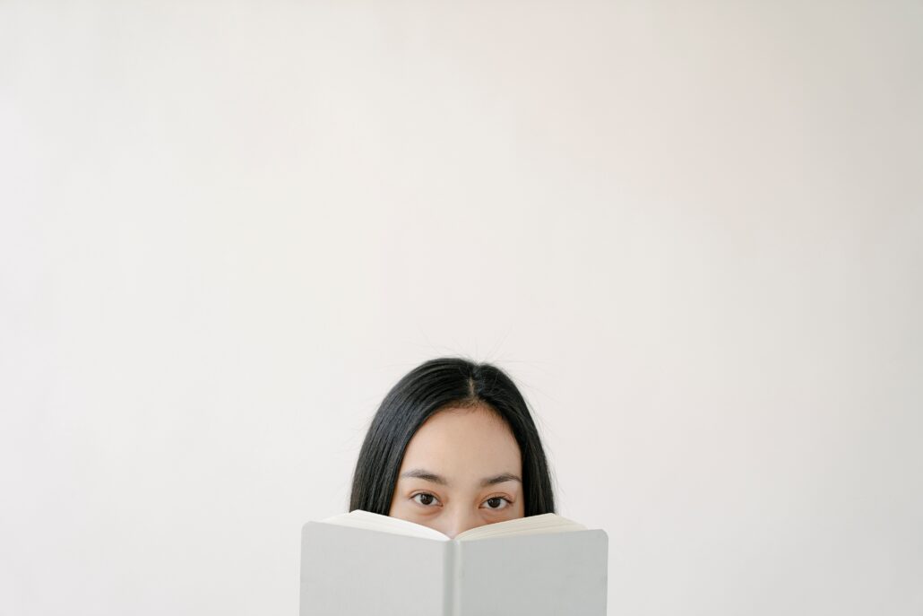 Coaching for introverts concept with a thoughtful person reading quietly, representing self-reflection and personal growth