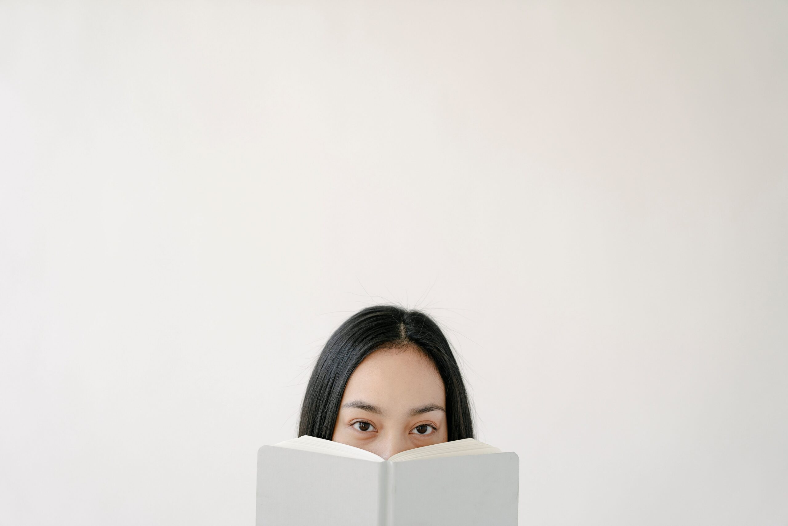 Coaching for introverts concept with a thoughtful person reading quietly, representing self-reflection and personal growth